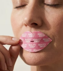 Applying Beauty Sleep mouth tape before bed