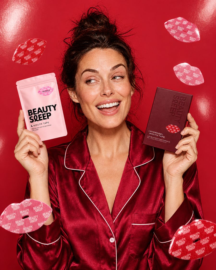 A woman laughing as she holds up Beauty Sleep Signature and Collagen Mouth Tape